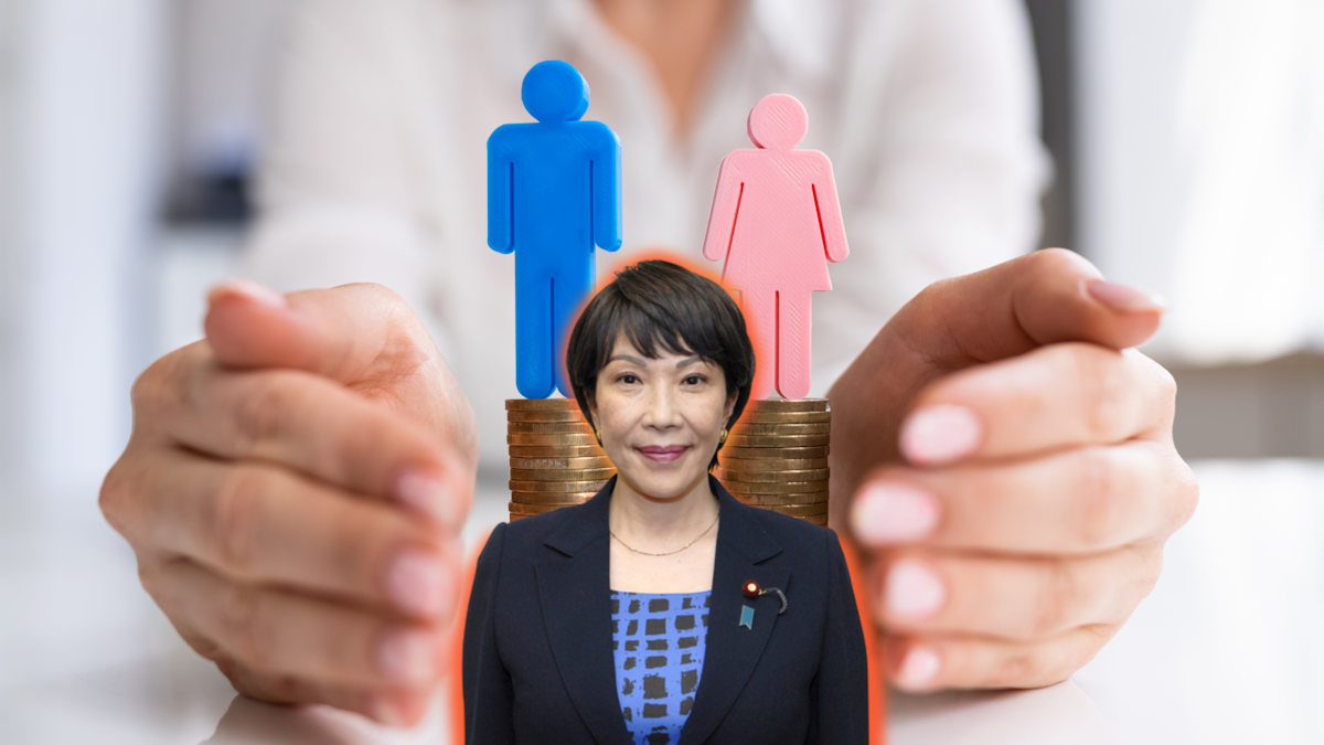 Takaichi Sanae standing in front of two stacks of coins, one with a blue male figure and one with a pink female figure